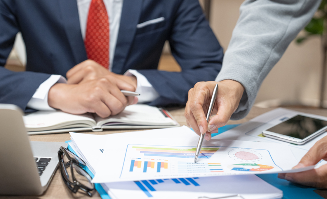 Business people negotiating a contract