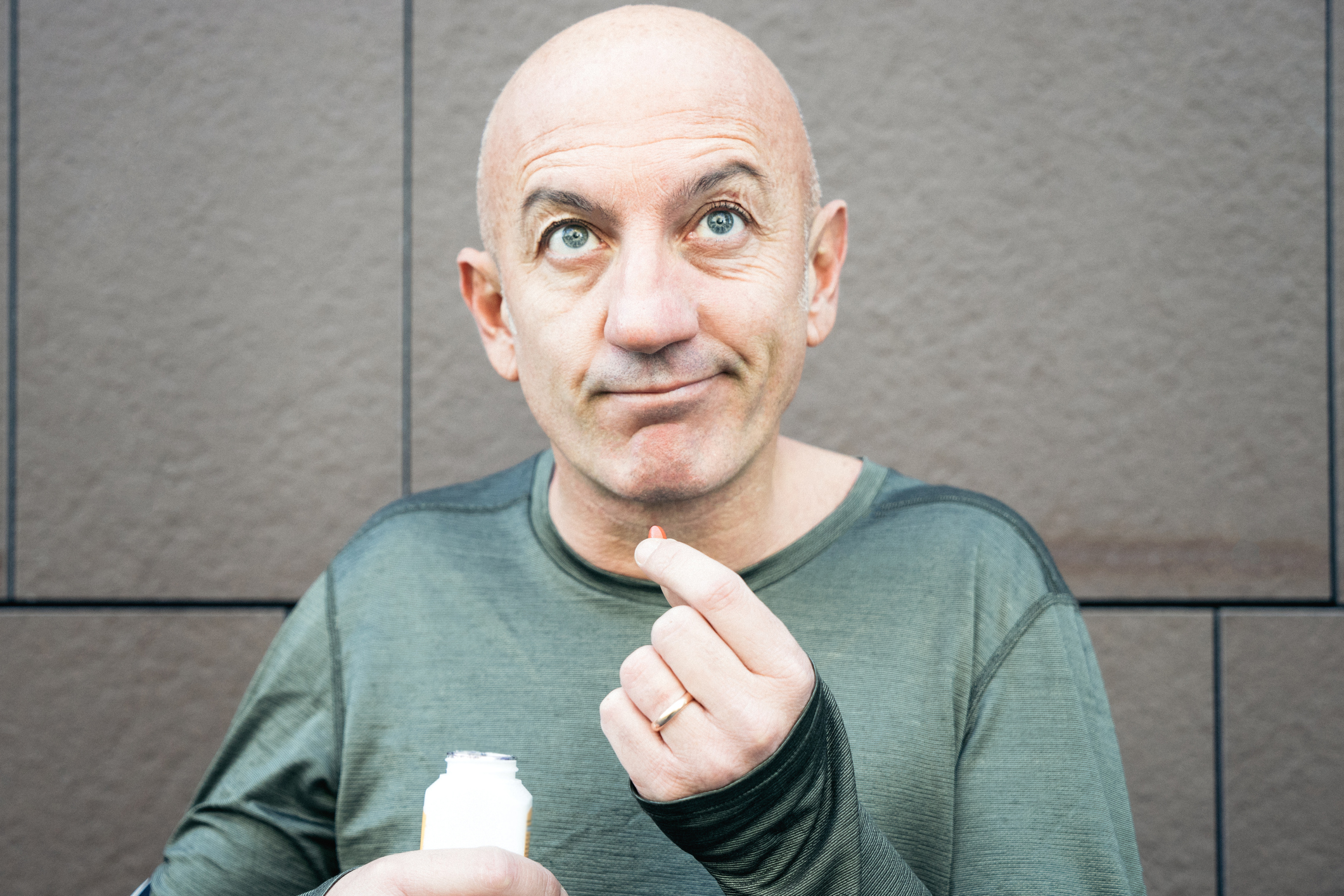 Athletic Mature Man Taking Supplements