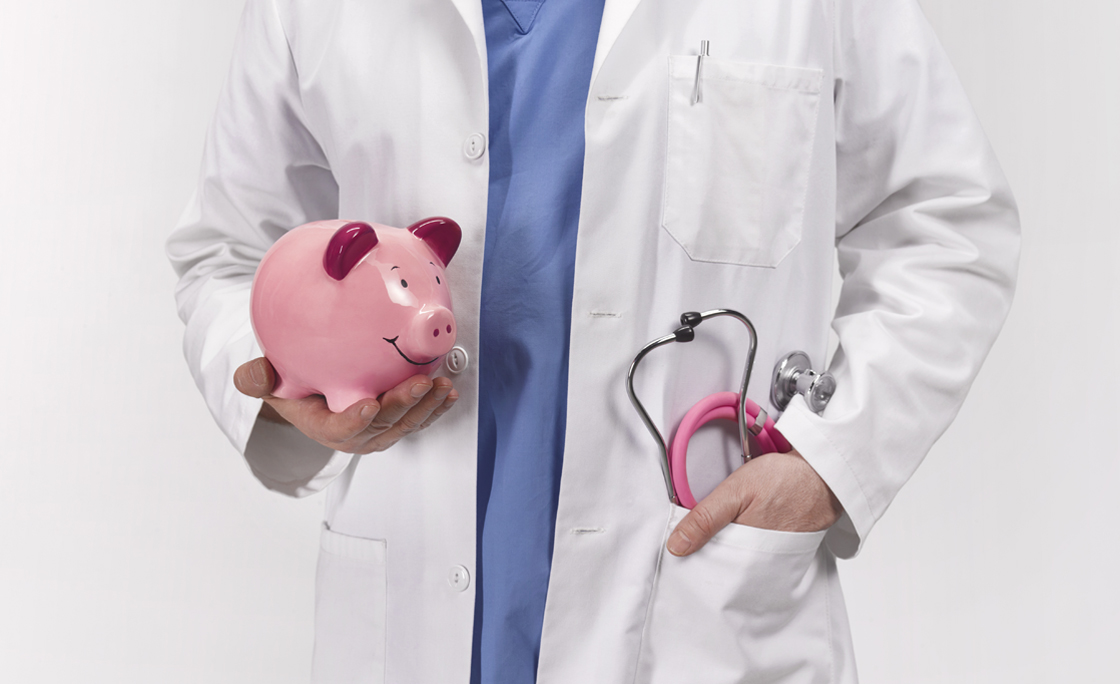 Doctor with piggy bank