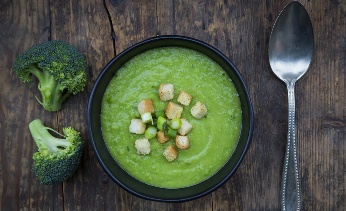 Broccoli soup in bowl, croutons