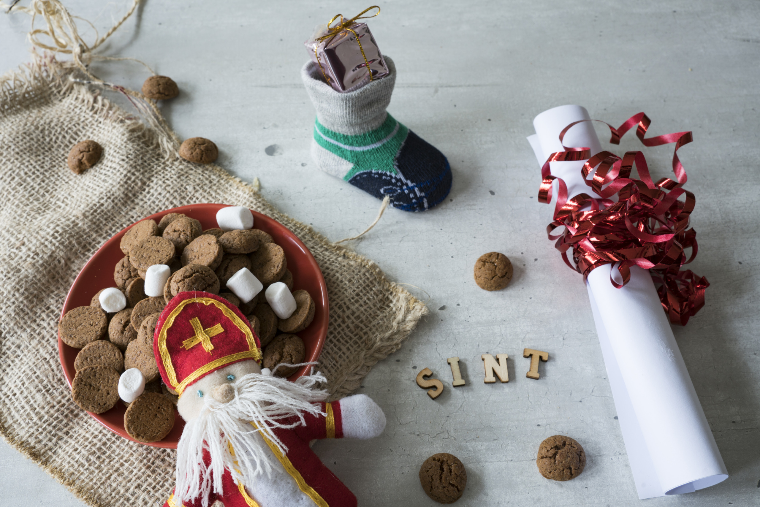 roll paper, sock and bowl with ginger nuts, kruidnoten, for Sinter event in The netherlands