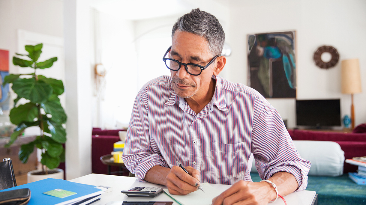 Mature man doing working at home