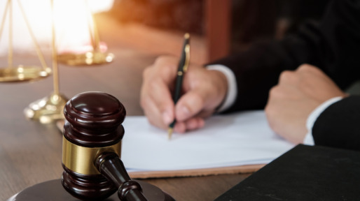 Law, lawyer attorney and justice concept, male lawyer or notary working on a documents and report of the important case in the law firm,bangkok,thailand