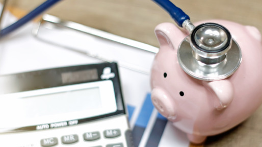 Stethoscope and calculator symbol for health care costs or medical insurance