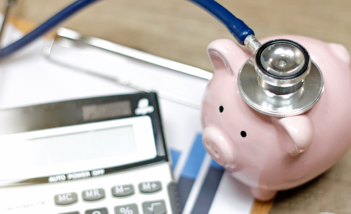 Stethoscope and calculator symbol for health care costs or medical insurance