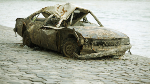 Wrecked car on waterfront