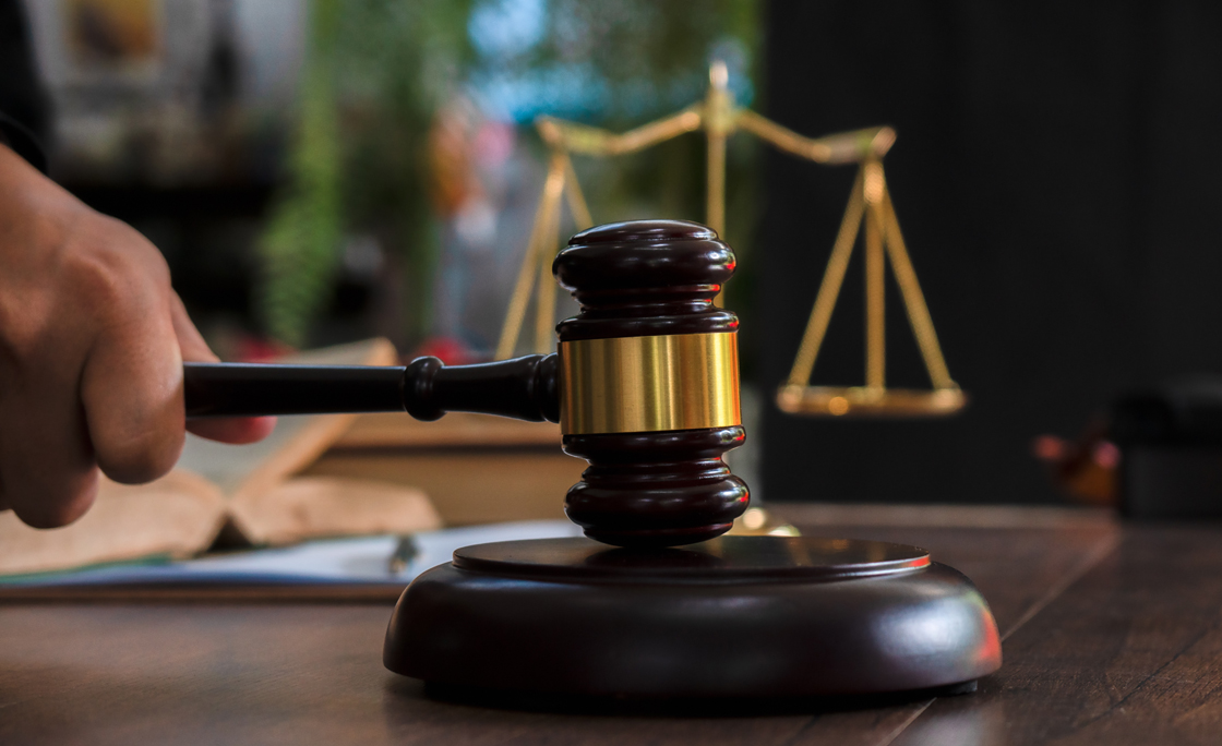 Law and justice concept. Judge’s gavel, scales, hourglass, books.