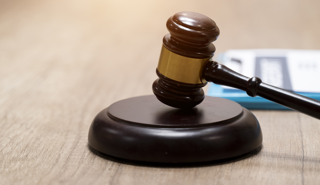 Judge gavel and scale in court. Legal concept