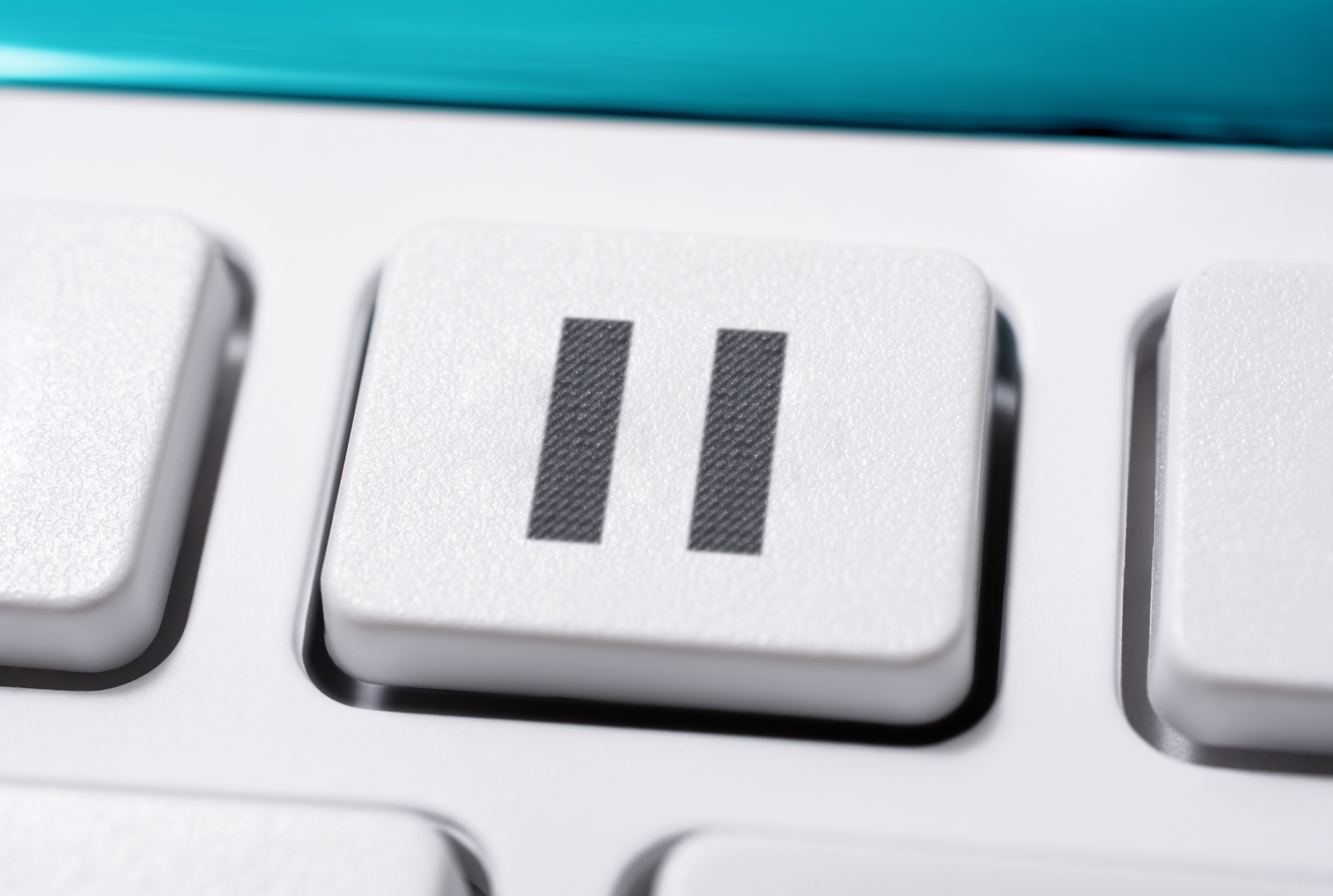 Close-Up Pause Icon On Button Of Computer Keyboard