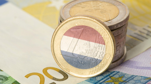 Euro notes and coins and flag of Holland