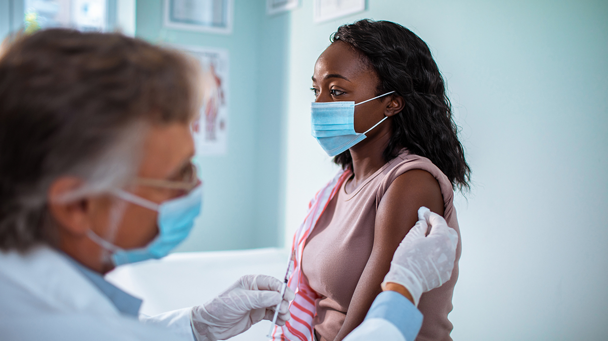 Young woman getting vaccinated