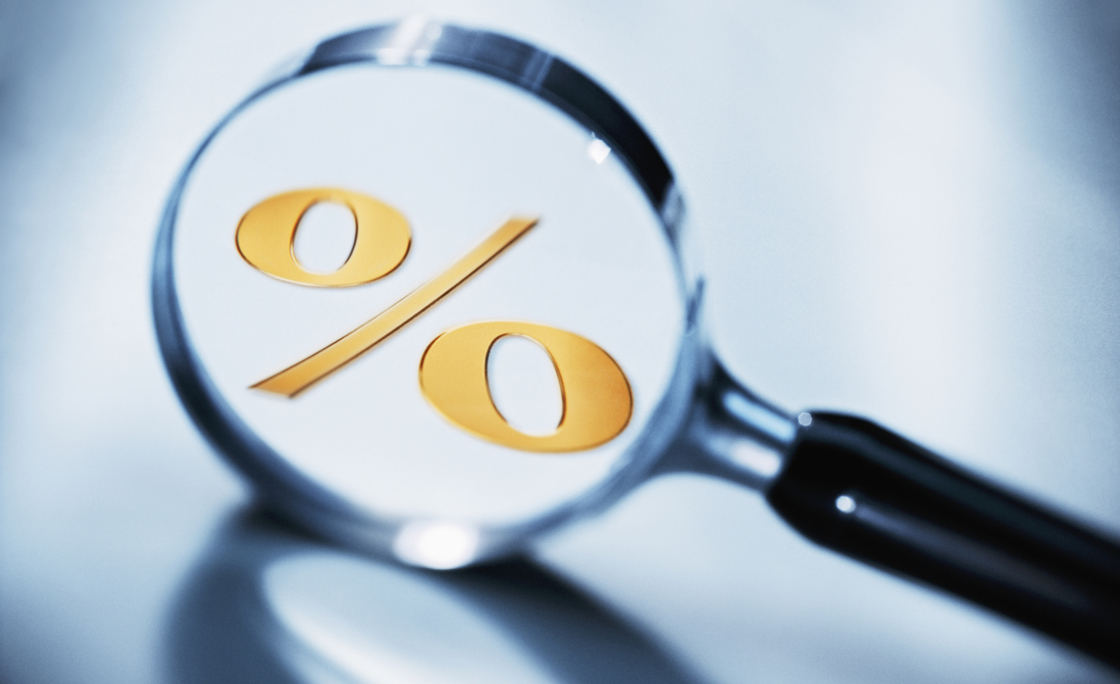 Percent sign in magnifying glass