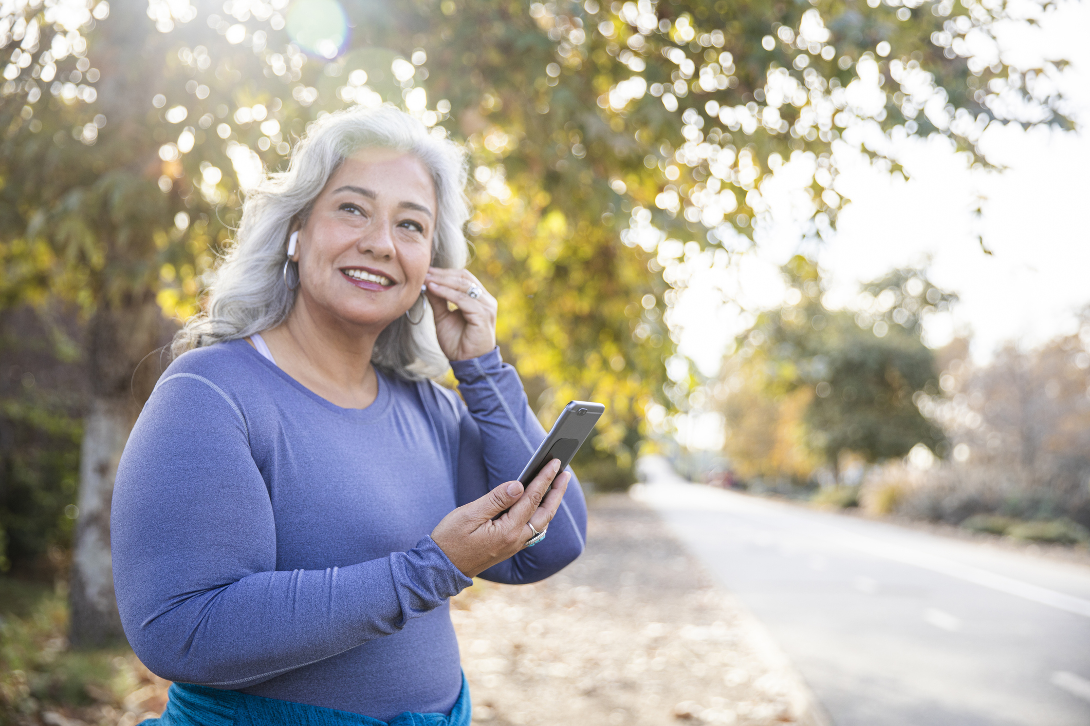 Beautiful Woman With Smartphone Getting Ready for Workout