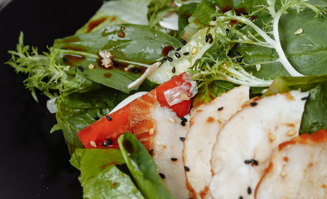 smoked chicken salad on a black plate