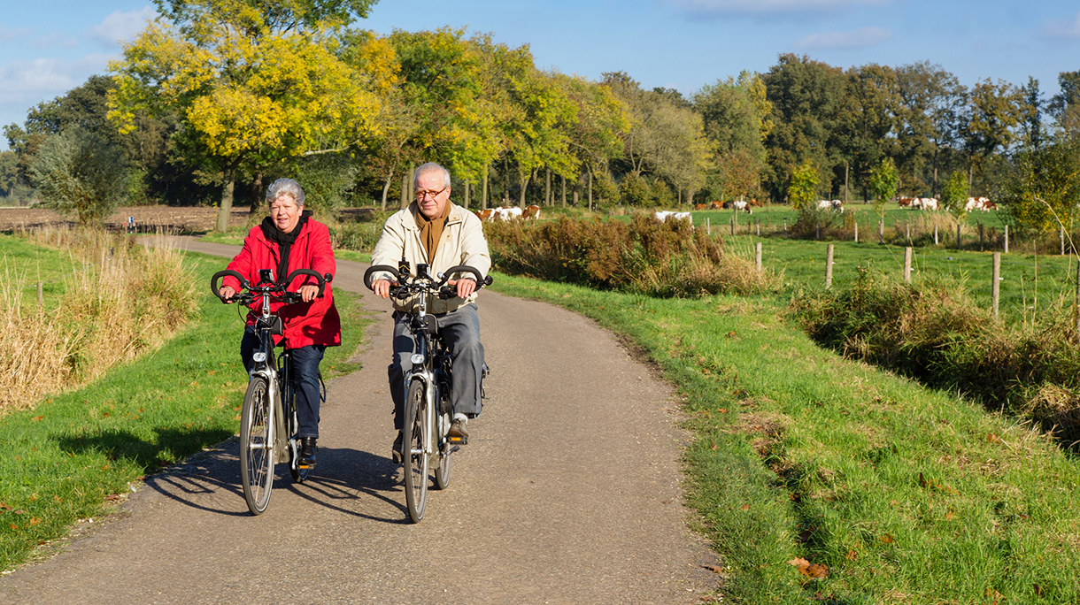 senior couple on a bicycle