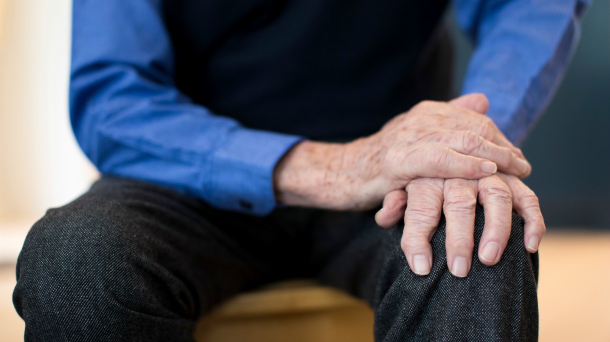 Close Up Of Senior Man Suffering With Parkinsons Diesease