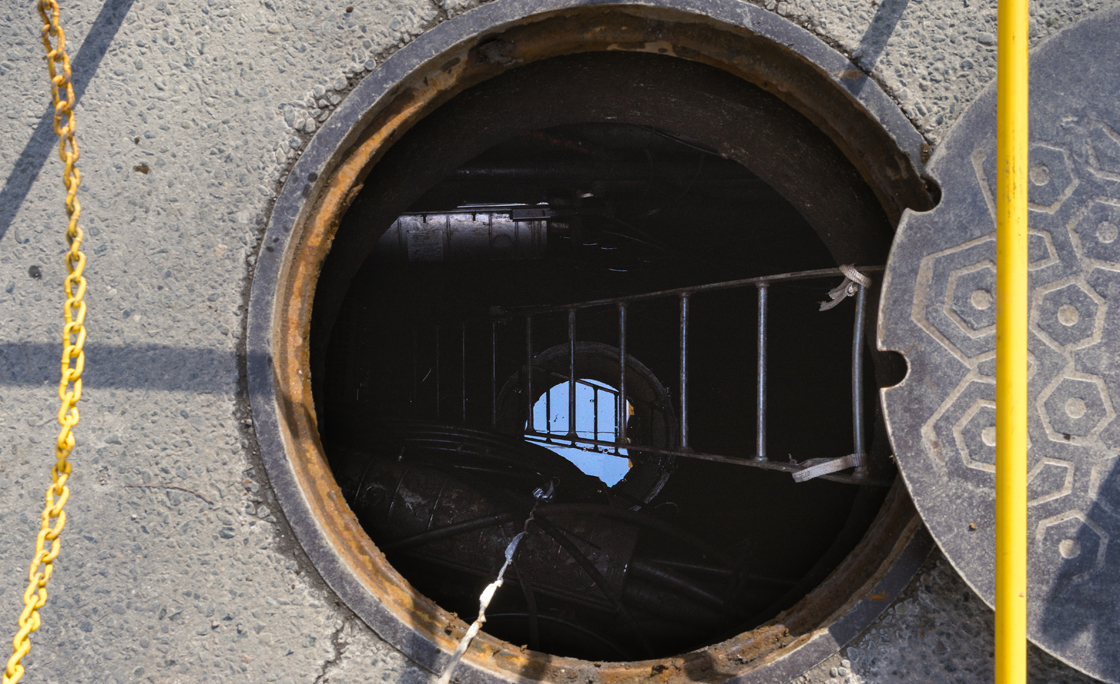 An open manhole on a city street