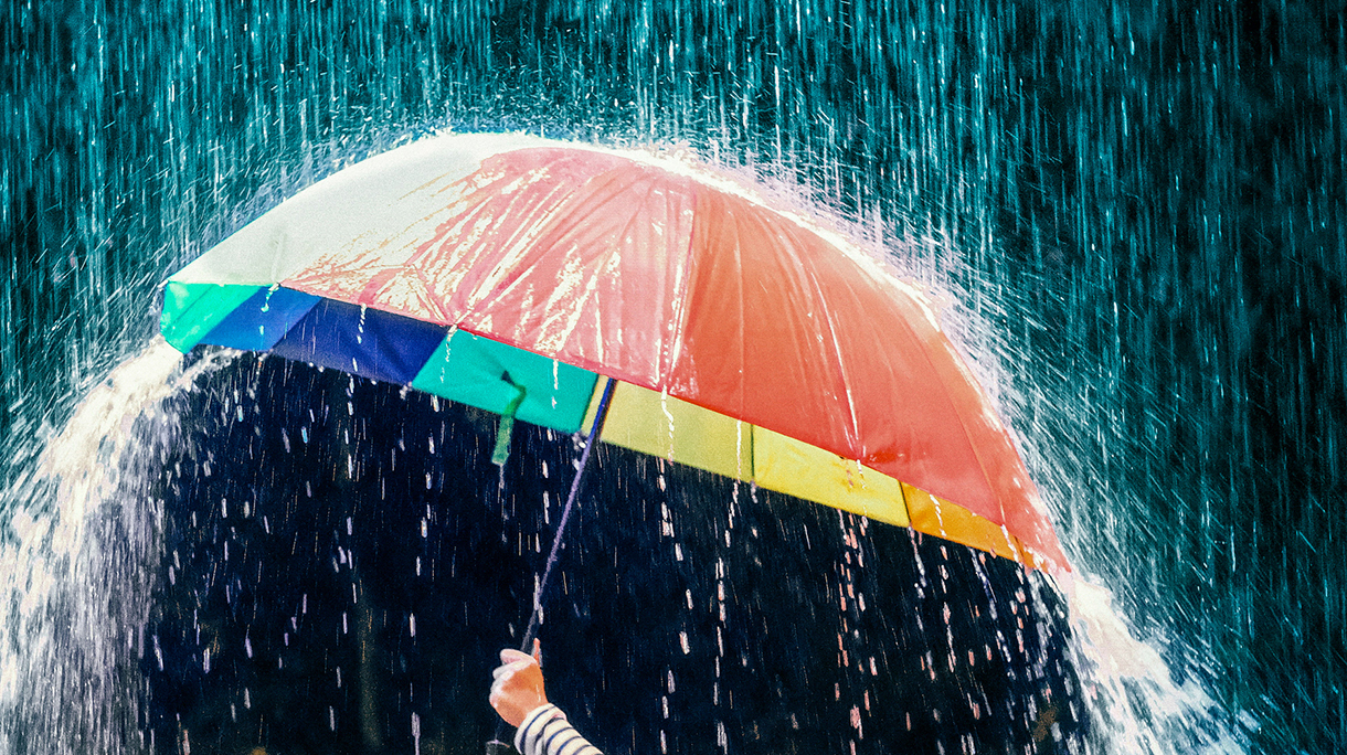 Cropped Hand Holding Umbrella During Rainfall