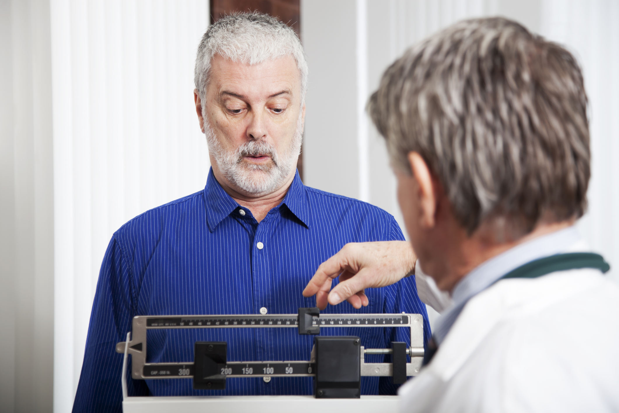 Doctor Weighing Patient