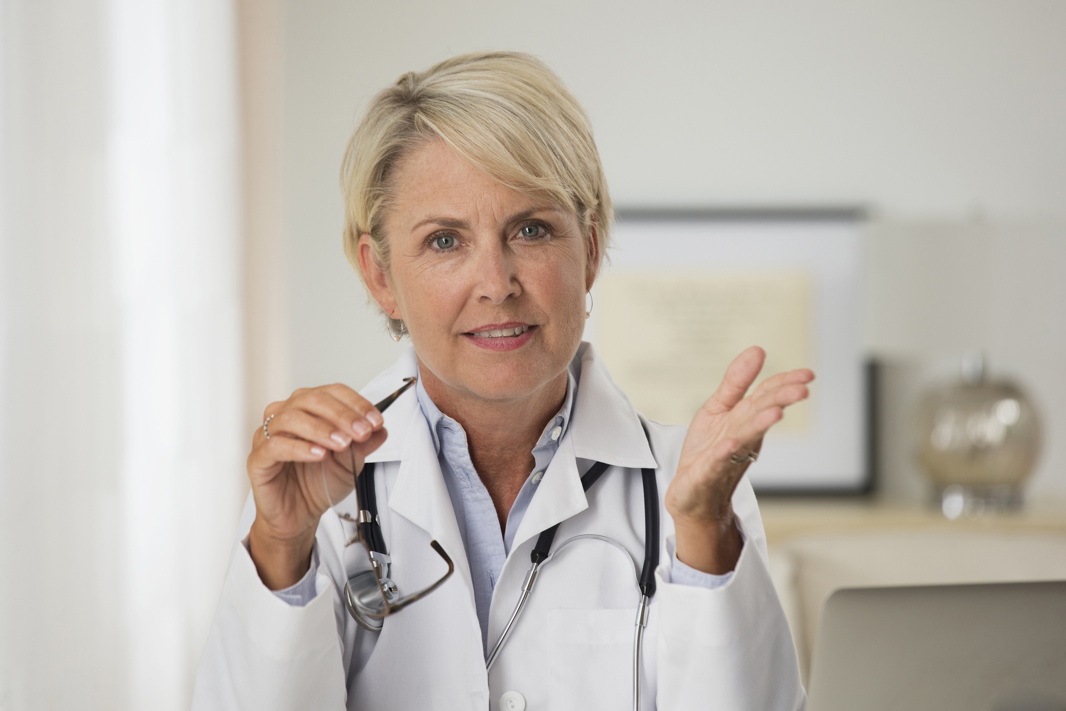 Caucasian doctor talking in office