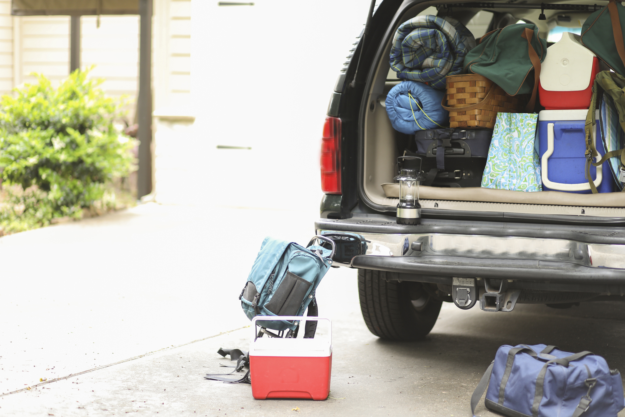 Packing vehicle for camping vacation trip.