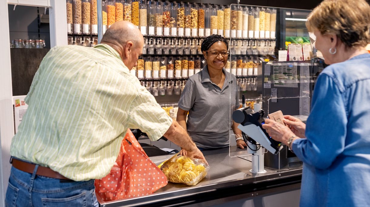 Senior couple buying grocery at supermarket