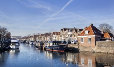 Historical houses and boats moored in Brielle