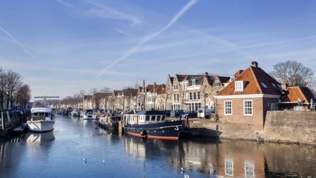 Historical houses and boats moored in Brielle