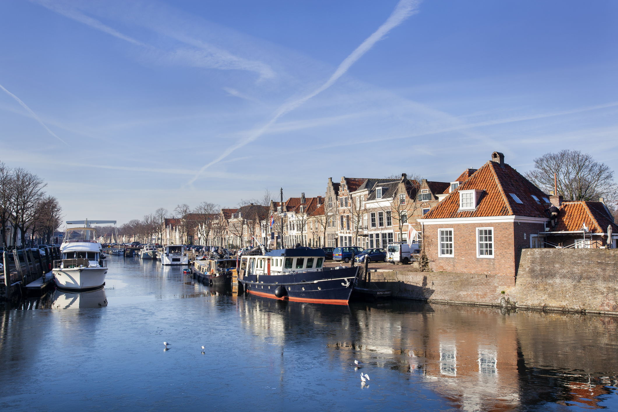 Historical houses and boats moored in Brielle