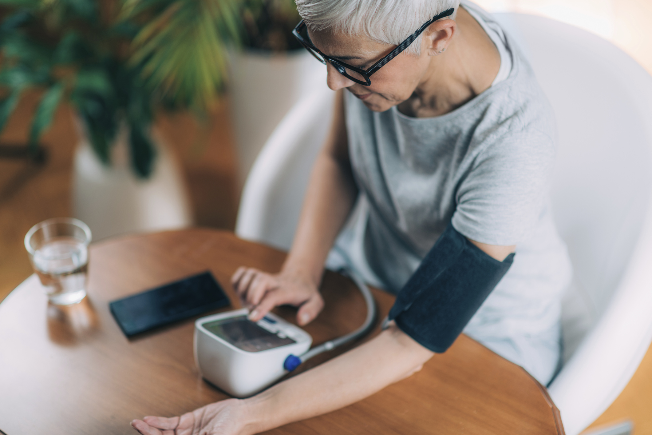 Senior woman measuring blood pressure