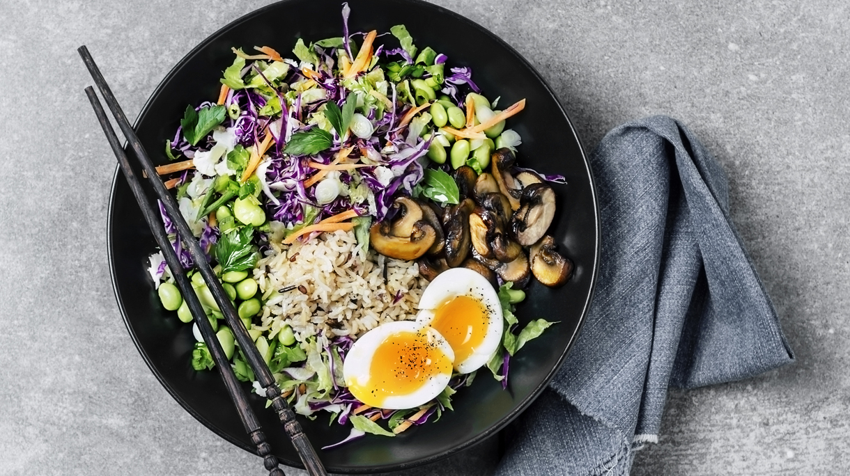 Fresh salad with fried rice and boiled eggs
