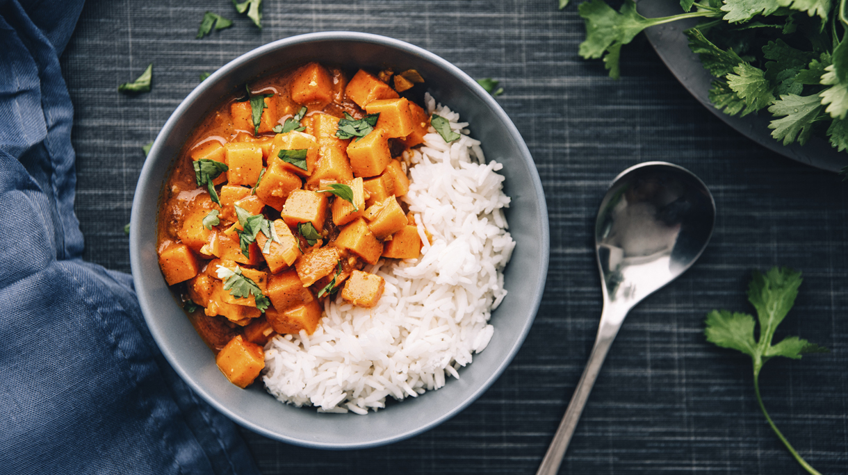 Bowl of sweetpotato ragout served with rice