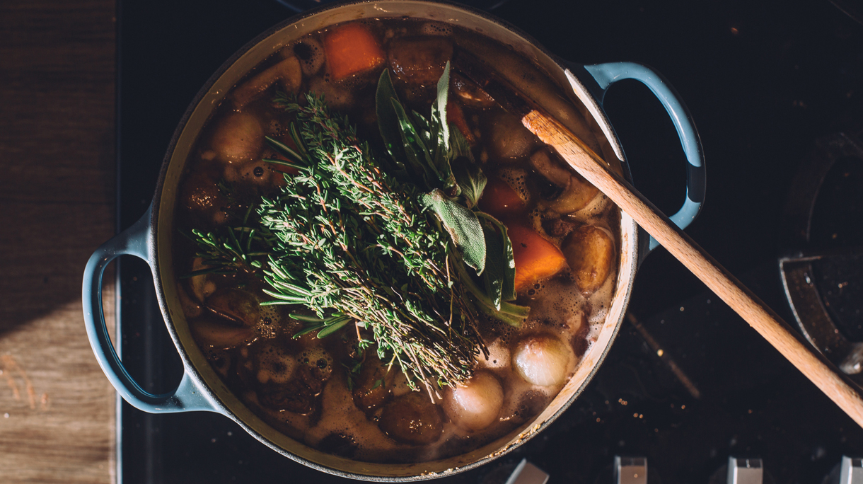 Stew in blue cast iron pot on stove