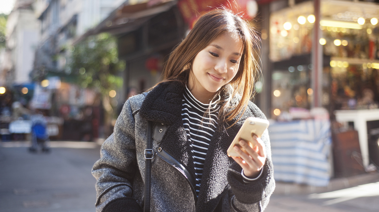 Young woman at mobile phone