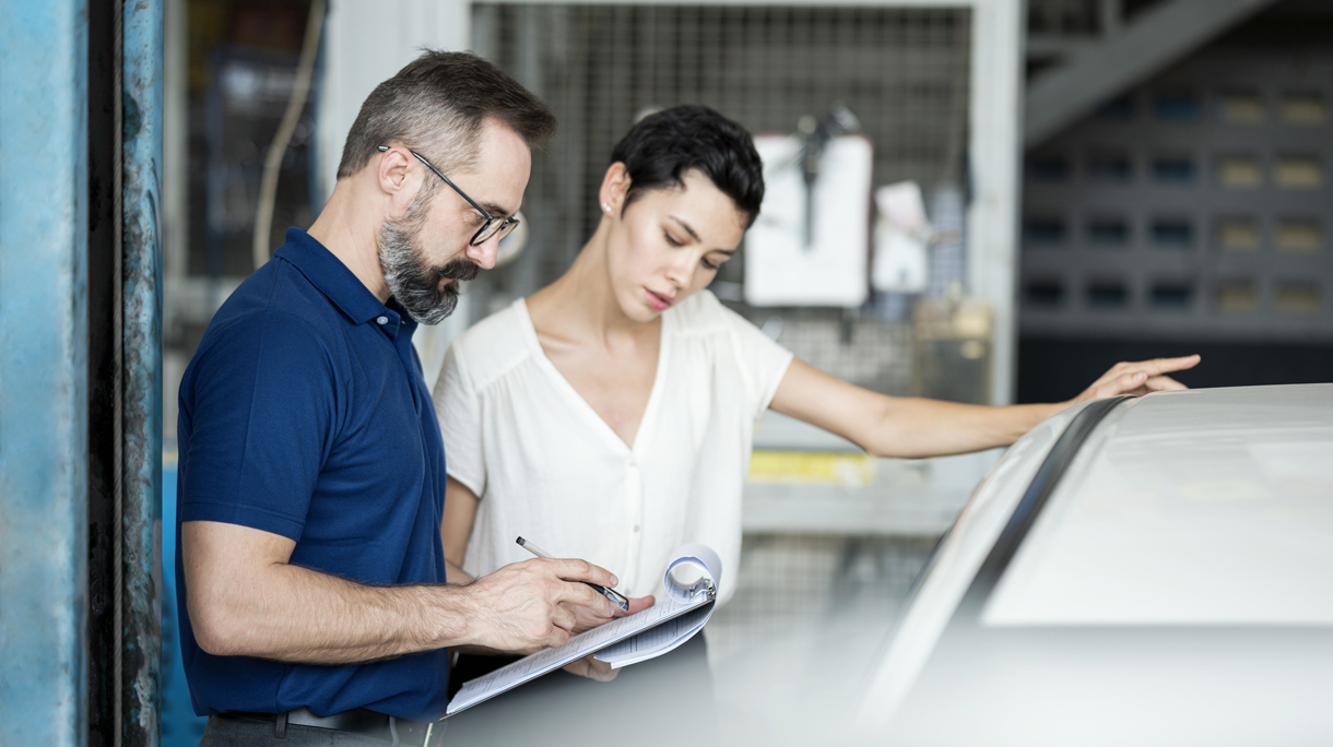 Car Insurance Claims. Insurance adjuster explaining damage of car exterior to customer at Auto Repair Center. Business hour 24/7 service coverage. Customer Service, Quality of Service.