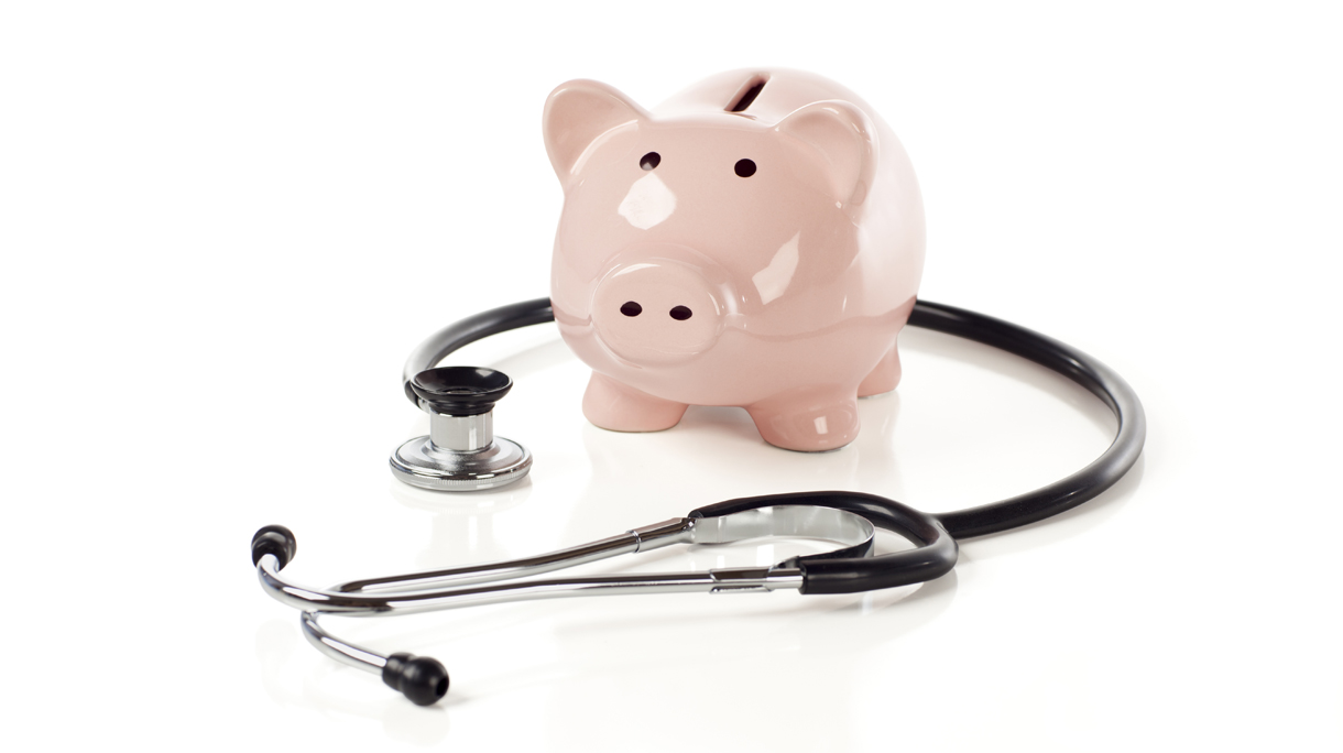 Piggy Bank and Stethoscope Isolated
