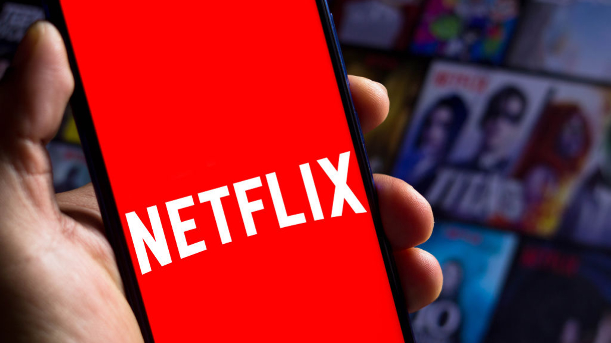 In this photo illustration the Netflix logo seen displayed