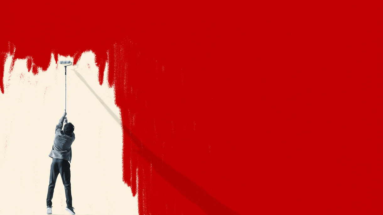 Man erasing red COVID-19 virus with paint roller