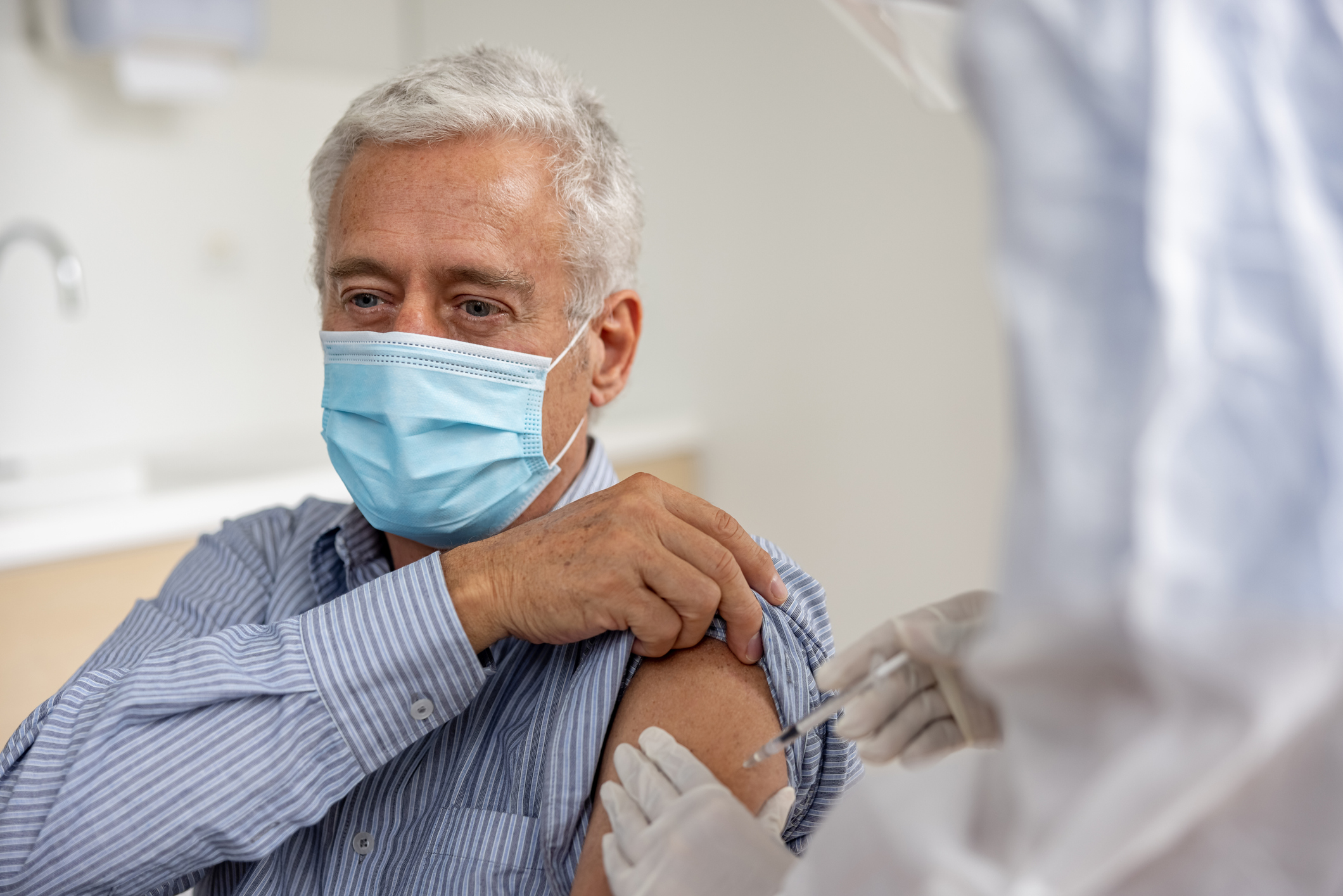 Man getting the COVID-19 vaccine at the hospital