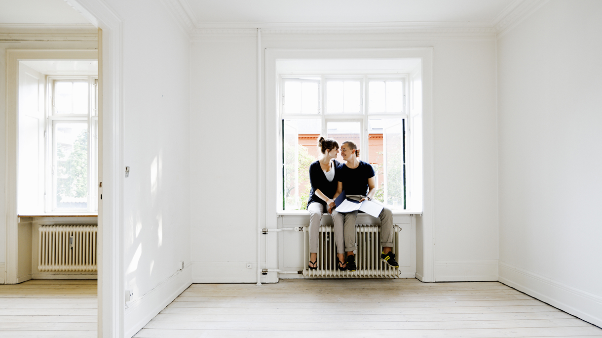 Couple sitting in window of new home