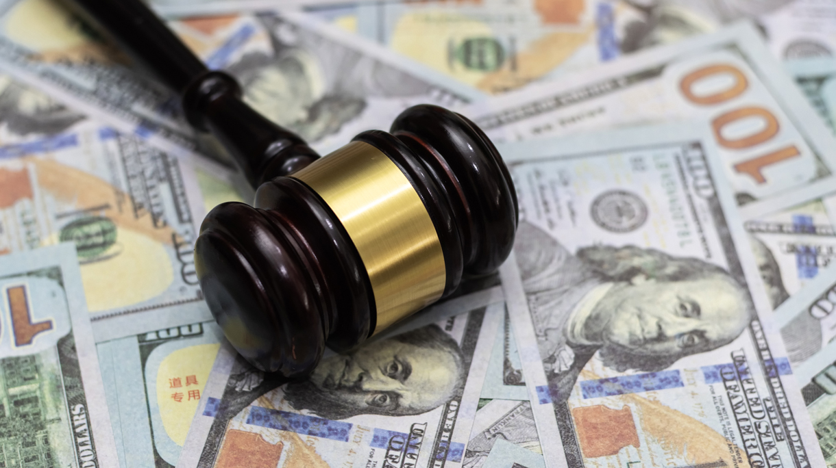 Money and hammer,Wooden gavel and dollar banknotes
