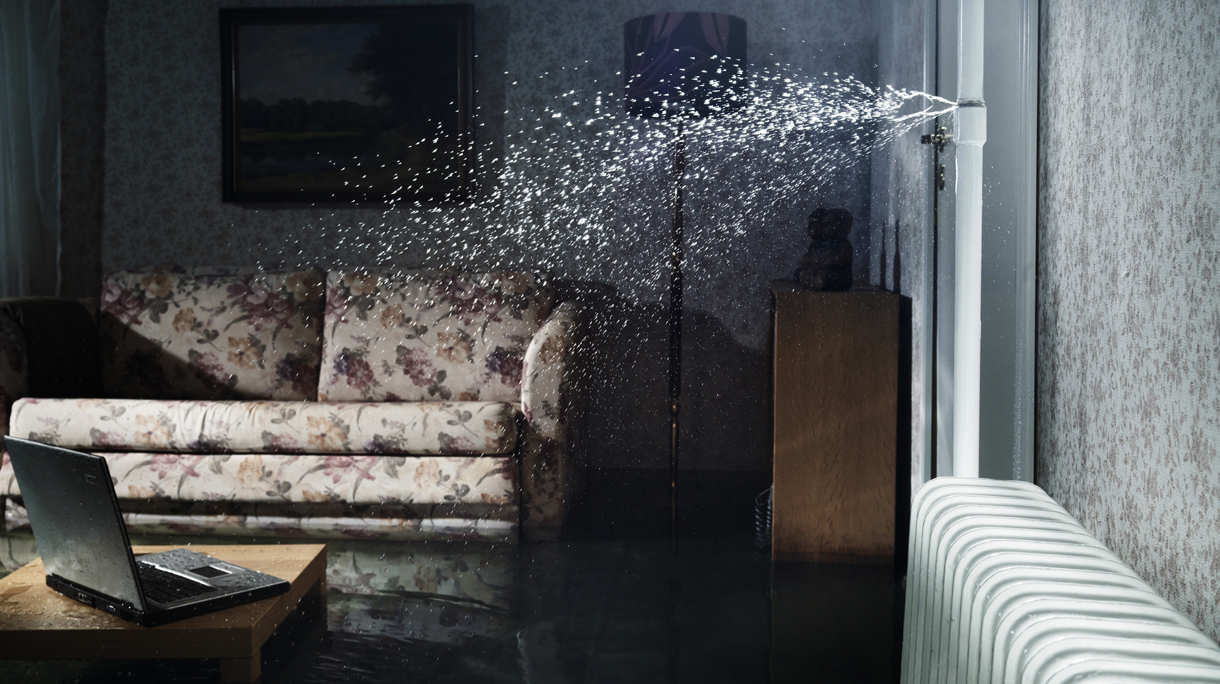 broken water pipe in flooded room