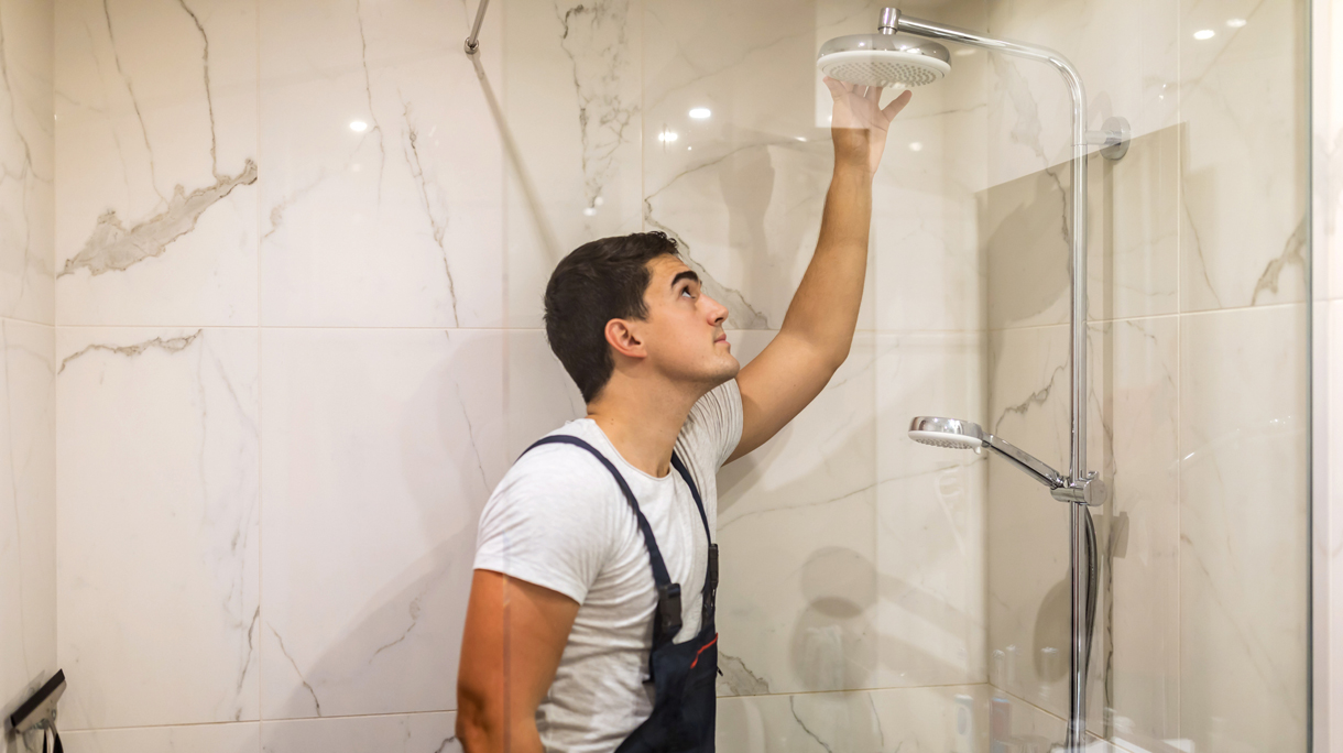 Replacing the plumbing in the bathroom mounted hand shower holder with height adjustable a shower head.