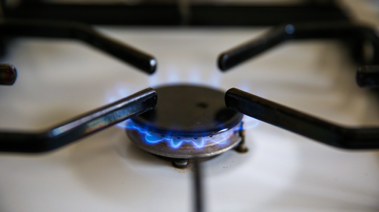 In this photo illustration, a gas ring is seen as gas bills