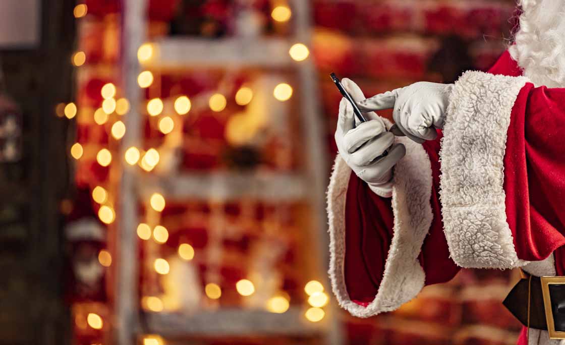 Real Santa Claus with mobile phone