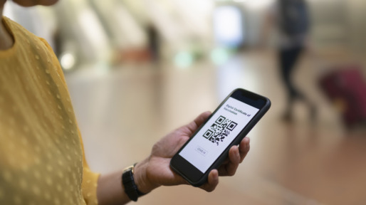 Woman holding phone with QR code