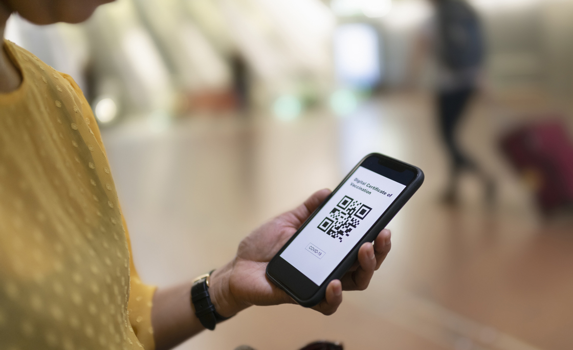 Woman holding phone with QR code