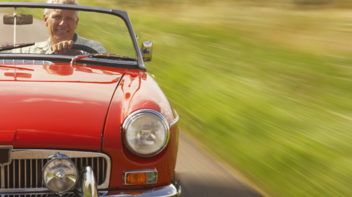 Senior man in sports car