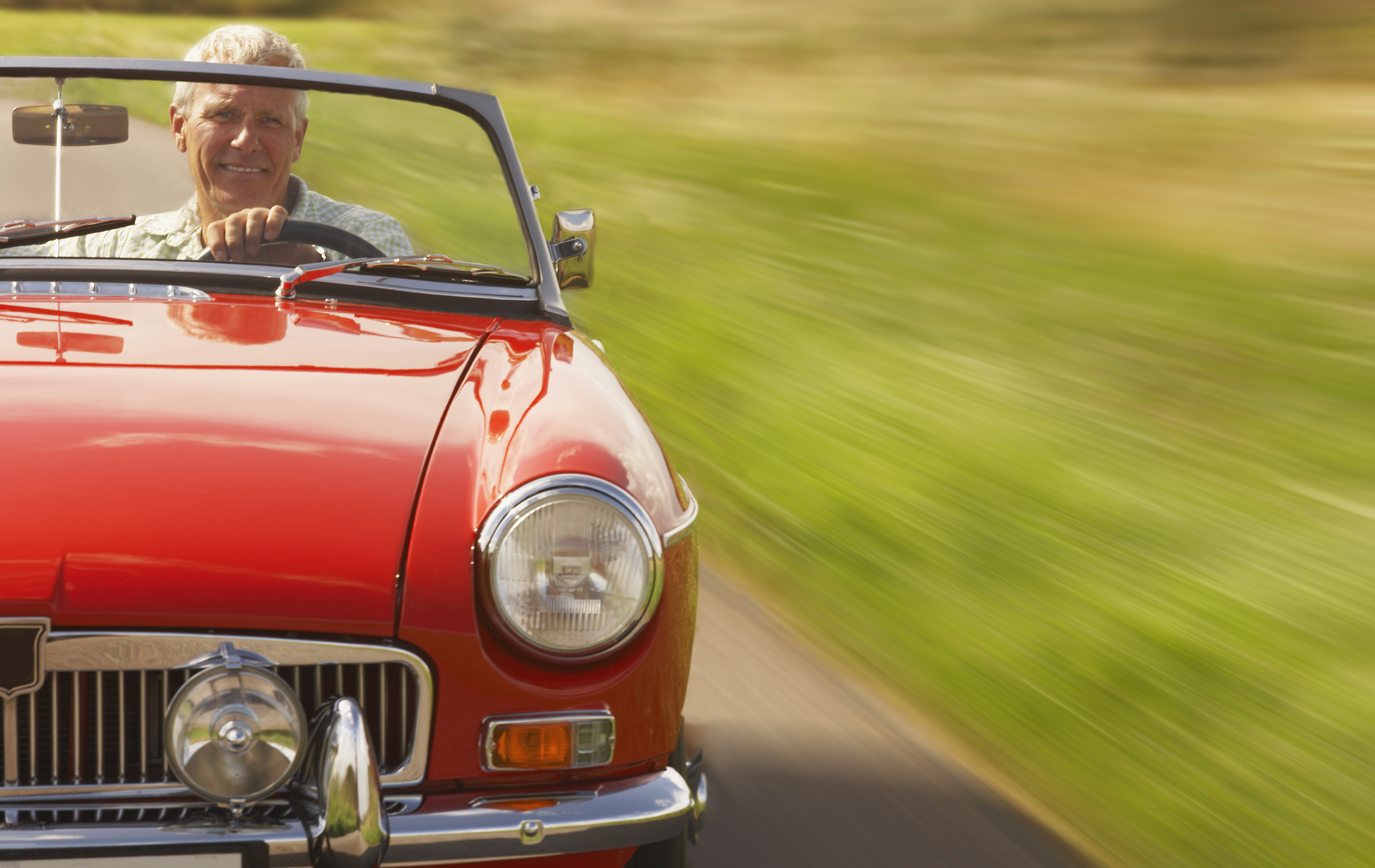 Senior man in sports car