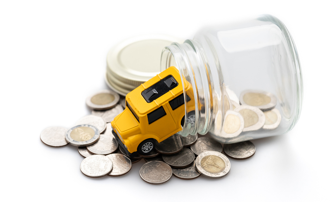 Wood House On Coins In A Jar Isolated On White Background, Saving And Investment Concept